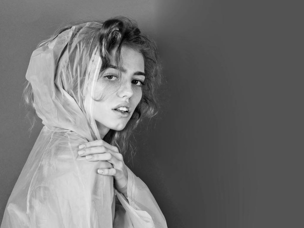 woman wearing plastic raincoat - Fotó, kép