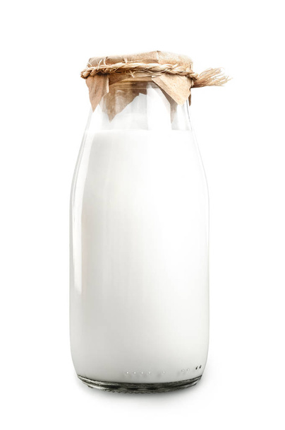 A bottle of fresh milk isolated on a white background closeup - Zdjęcie, obraz