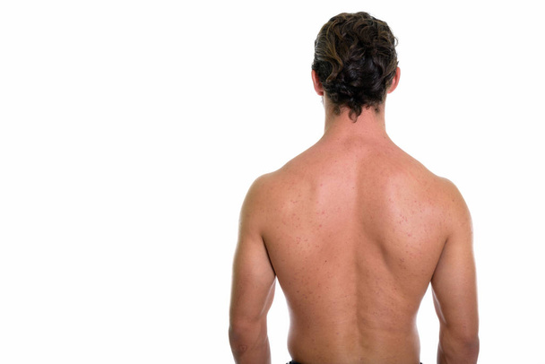 Back view of young handsome man shirtless isolated against white - Фото, зображення
