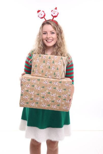 Blonde girl with Christmas boxes - Фото, изображение