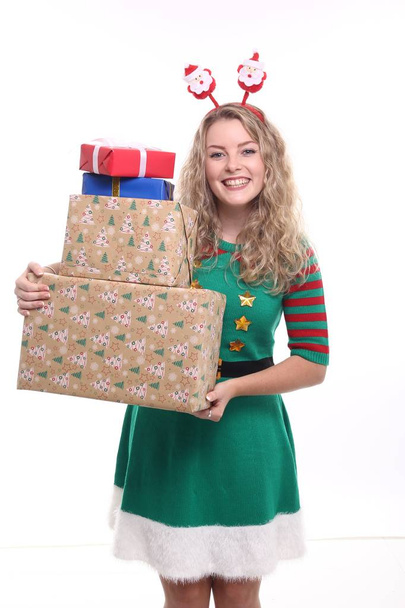 Blonde girl with Christmas boxes - Valokuva, kuva
