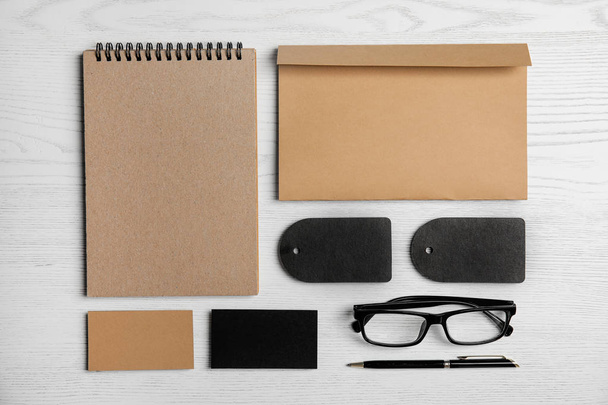 Flat lay composition with stationery on white wooden background. Mock up for design - Foto, afbeelding