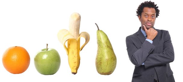 Set of different fruits with afro-american man - Foto, imagen