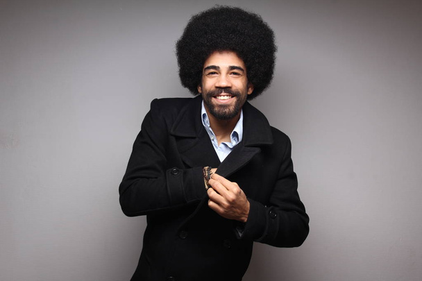 Happy black man posing on white background - Photo, image