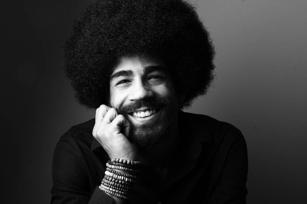 Happy black man on black and white thone - Fotografie, Obrázek