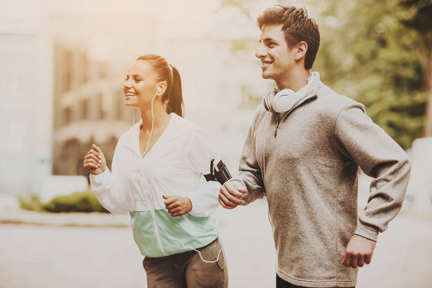 Young Happy Couple During Jogging in Morning. - Φωτογραφία, εικόνα