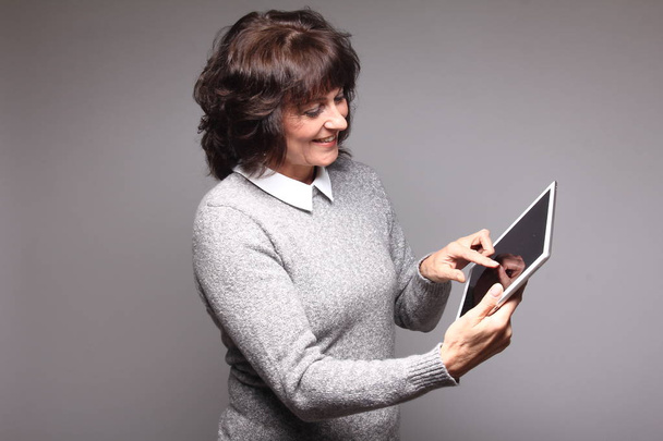Adult woman using tablet pc - Foto, Imagem