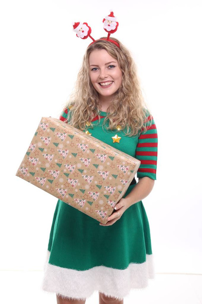 Blonde girl with Christmas gift - Фото, изображение