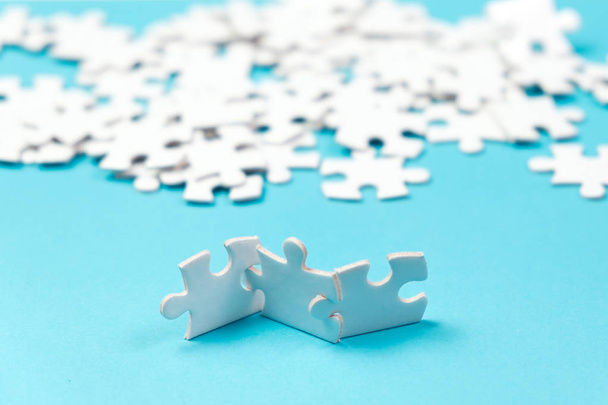 Three pieces of white jigsaw puzzle - Photo, Image