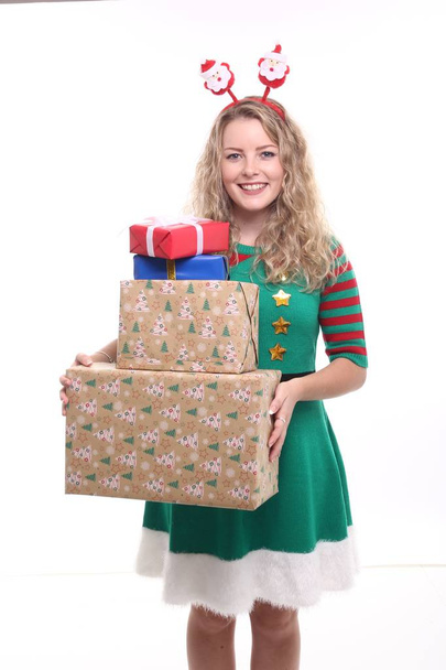 Blonde girl with Christmas boxes - Foto, afbeelding
