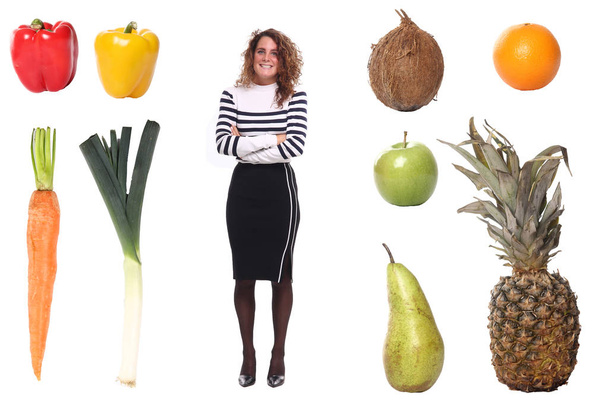 Caucasian young girl with different vegetables and fruits - Foto, immagini