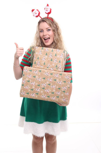 Blonde girl with Christmas boxes - Foto, immagini