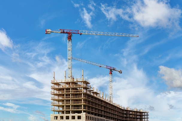 construction site with cranes on sky background - Photo, Image
