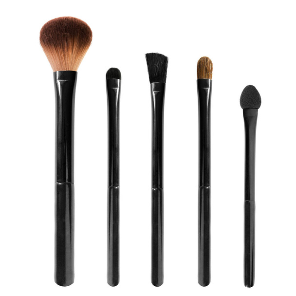 Set of black makeup brushes and one sponge on white background - Foto, immagini