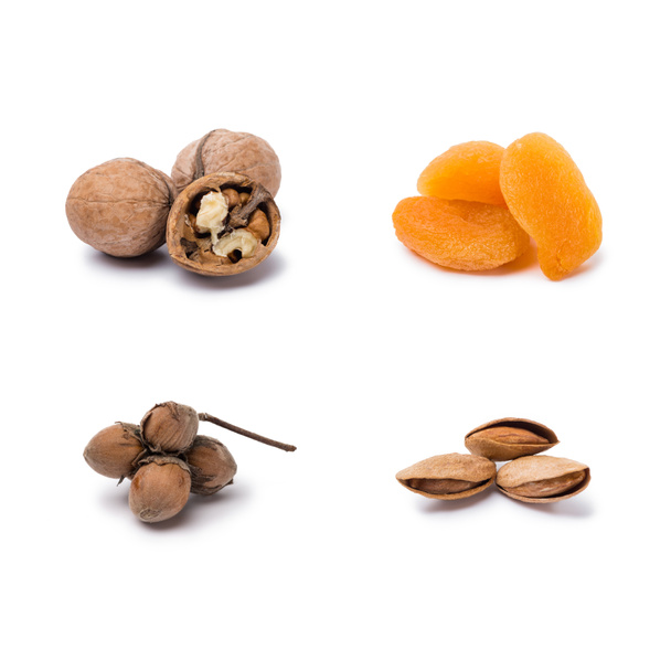 handfuls of assorted nuts and dried apricots isolated on white background - Photo, Image