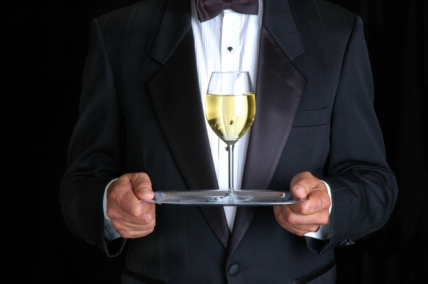 Man Holding a Glass of Wine on a Tray - Photo, Image