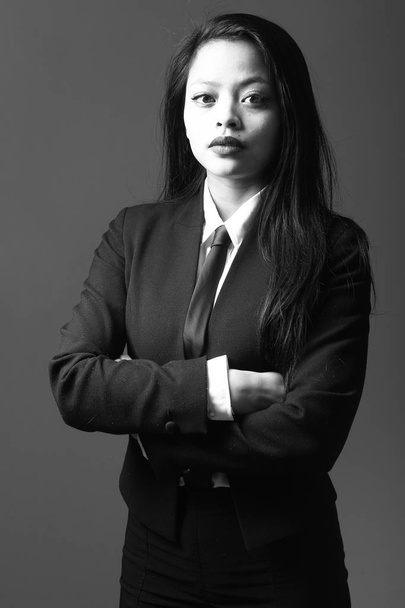 Serious asian woman on black and white tone - Фото, изображение