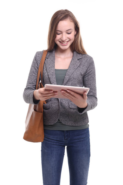 Caucasian girl is using tablet PC - Foto, Imagen