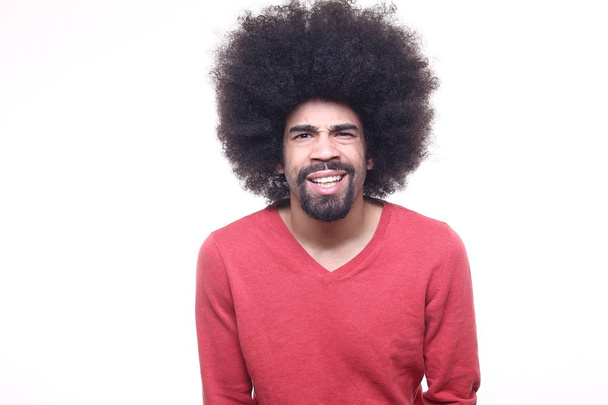 Surprised black man with curly hair - Zdjęcie, obraz