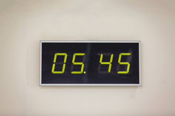 Black digital clock on a white background showing 5 hours 45 minutes - Photo, Image