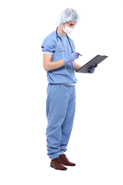 Male doctor wearing special uniform with stethoscope and clipboard - Foto, Imagen
