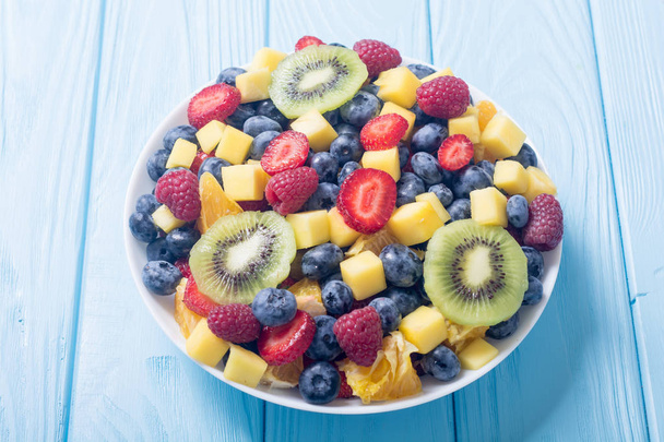 Fresh fruit and berries salad . Healthy vitamin food background . - Photo, Image