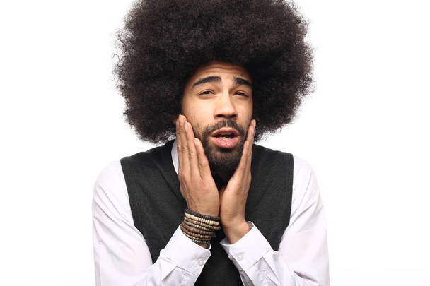Emotional  afro man in front of a white background - Foto, Imagem