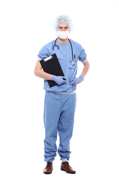 Male doctor wearing special uniform with stethoscope and clipboard - Zdjęcie, obraz