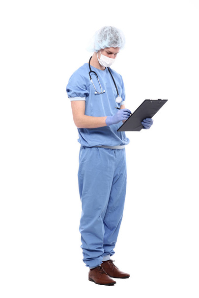 Male doctor wearing special uniform with stethoscope and clipboard - Foto, immagini