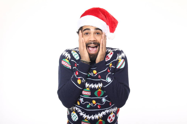 Emotional black man in Christmas clothes - Фото, изображение