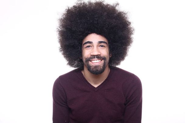 Happy afro-american man with big curly hair - 写真・画像