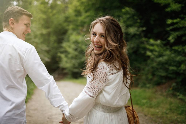 happy pregnant bride and stylish groom outdoor  - Zdjęcie, obraz