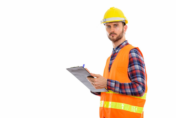 Young handsome bearded man construction worker - Photo, Image