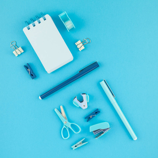 Top view knolling flat lay of workspace desk styled design school and office supplies with copy space turquoise blue color paper background minimal style. Square Template feminine blog social media - Photo, Image