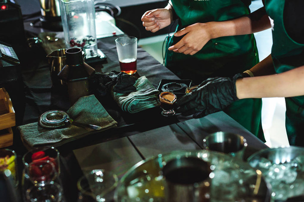 championship among coffee houses, members of teams show barista's skill, prepare drinks, teamwork - Foto, afbeelding