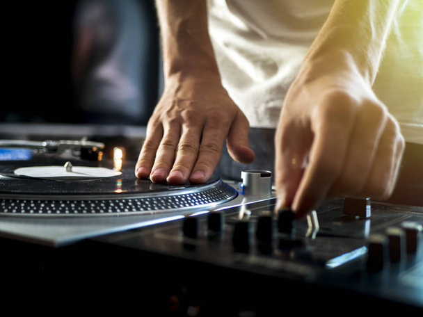 dj hands on professional music equipment deck vinyl record turntable and timecode - Φωτογραφία, εικόνα