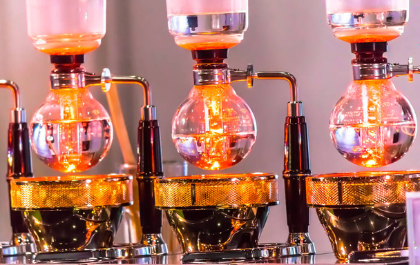 Syphon Coffee or Vacuum Coffee is full immersion tasteful, Blended smell and taste of roasted coffee with direct contact boiled water and show boiling water, stunning vacuum process by Beam heater. - Photo, Image