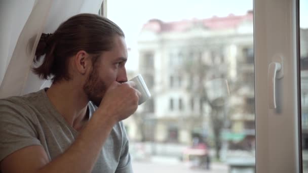 Man Drinking Coffee And Enjoying View From Window - Video, Çekim