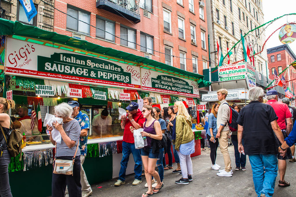NEW YORK CITY - SEPTEMBER 21, 2017:  View of the Annual Feast of San Gennaro street festival on the street of Little Italy in Manhattan with food vendors, decorations and real people in view.  - Zdjęcie, obraz