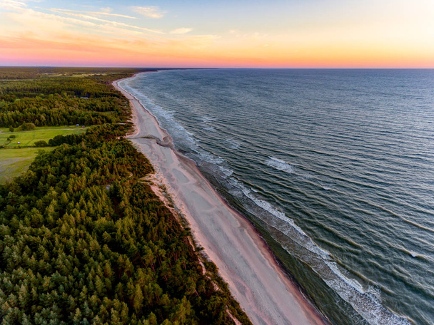 Drone image. aerial view of red sunset in the sea beach. shore line. baltic sea at dust - vintage retro look - Foto, immagini