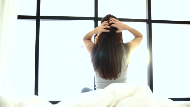 Morning Waking Up. Woman Sitting On Bed And Stretching - Video