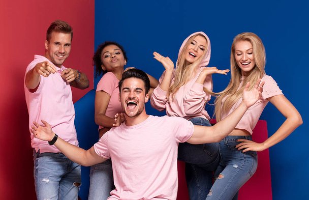 Group of young multi-ethnic attractive people smiling and having fun together, posing on colorful background.  - Fotoğraf, Görsel