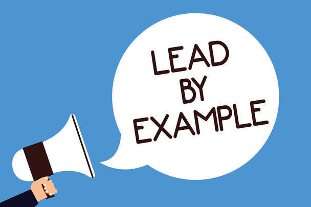 Writing note showing Lead By Example. Business photo showcasing Be a mentor leader follow the rules give examples Coach Man hold megaphone loudspeaker speech bubble screaming blue background - Photo, Image