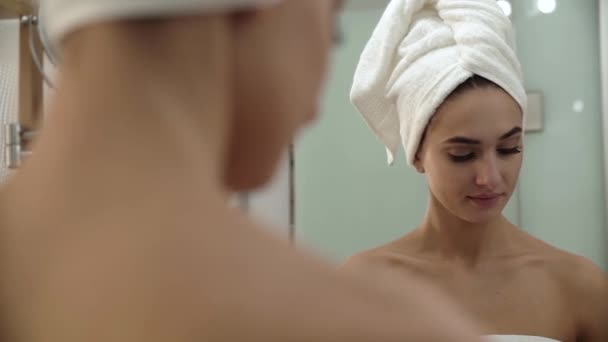 Skin Care. Woman Cleaning Face With Lotion At Bathroom - Filmagem, Vídeo