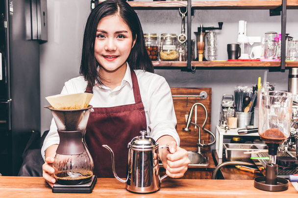 Women Barista making drip coffee in the cafe - Photo, Image
