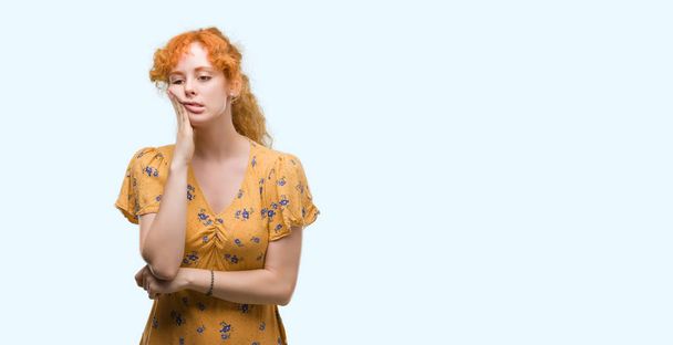 Young redhead woman thinking looking tired and bored with depression problems with crossed arms. - Photo, Image