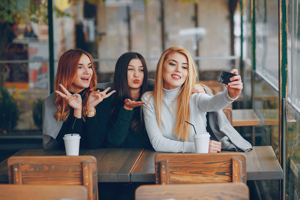 Three girls in cafe - Фото, изображение