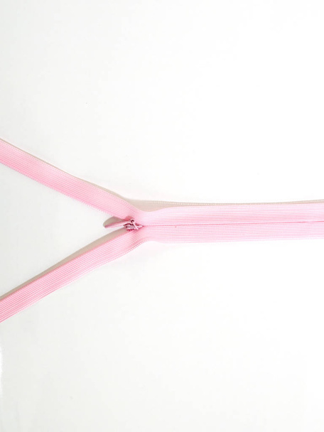 Pink zipper on white Background empty blank for text, Sun Side light - Photo, image