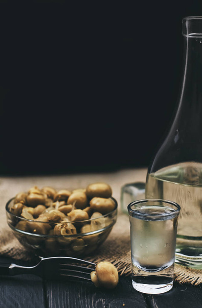 Traditional russian ice vodka with pickled mushrooms - Fotografie, Obrázek
