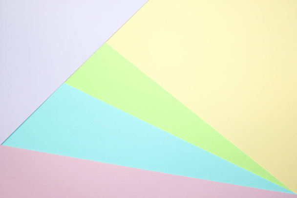 Fashionable  pastel colored paper flat lay top view, geometric background texture, pink, purple, yellow, beige, green and blue colour. - Foto, imagen